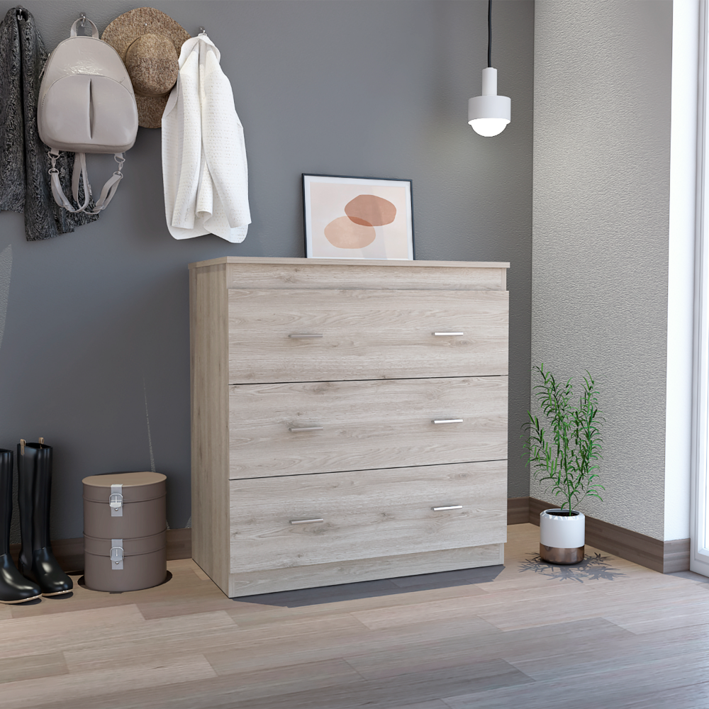 Whysk Three Drawer Dresser in light gray and white with three spacious drawers and a superior top for decoration.