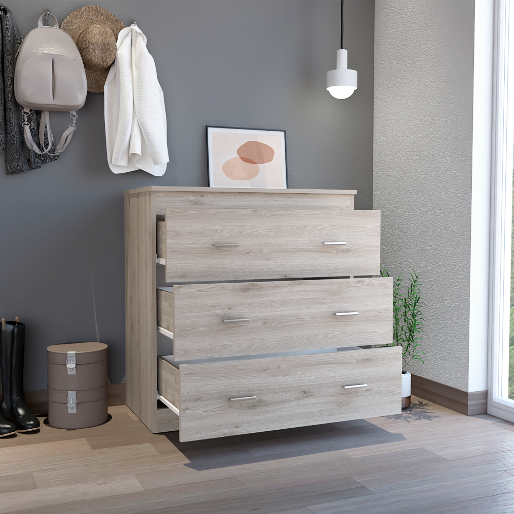 Whysk Three Drawer Dresser in light gray and white with three spacious drawers and a superior top for decoration.