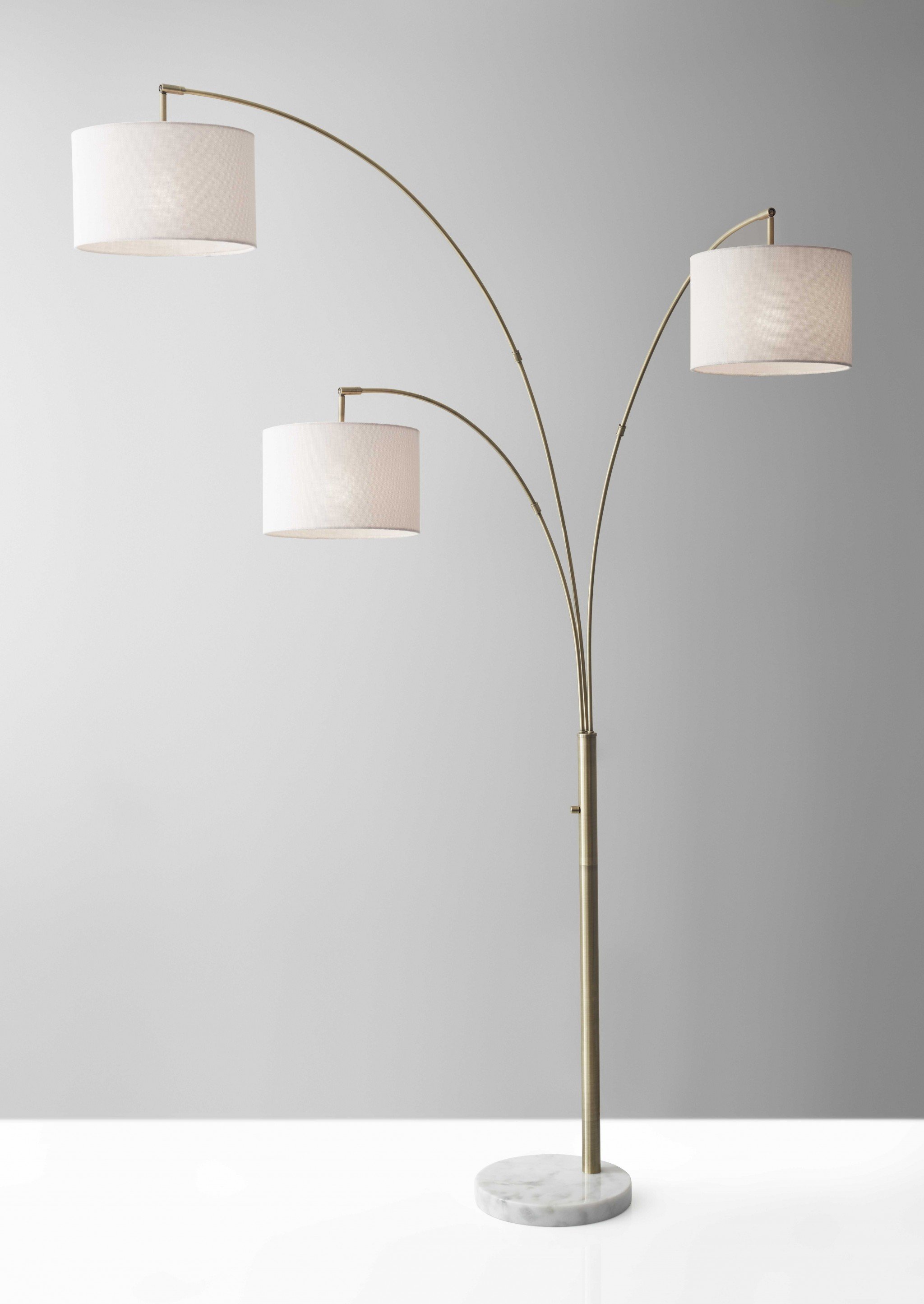 Three Light Floor Lamp with Brass Metal Arc Arms and White Marble Base, featuring adjustable shades and a rotary switch.