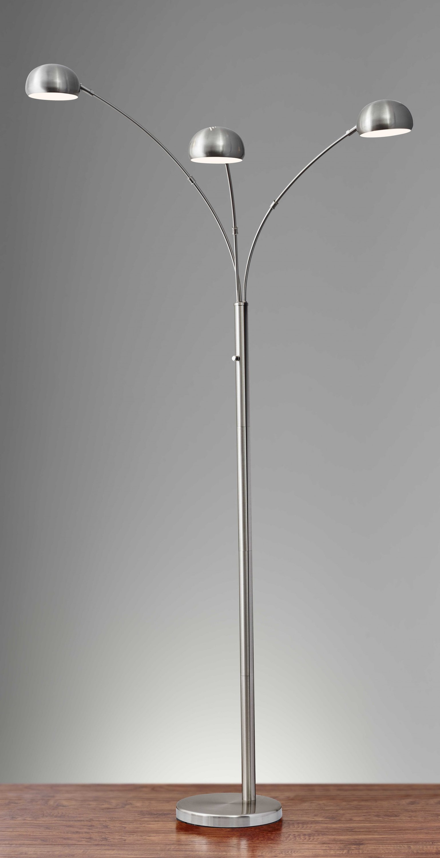 Three Light Steel Orb Floor Lamp with adjustable satin steel shades and included bulbs, standing 84 inches tall.