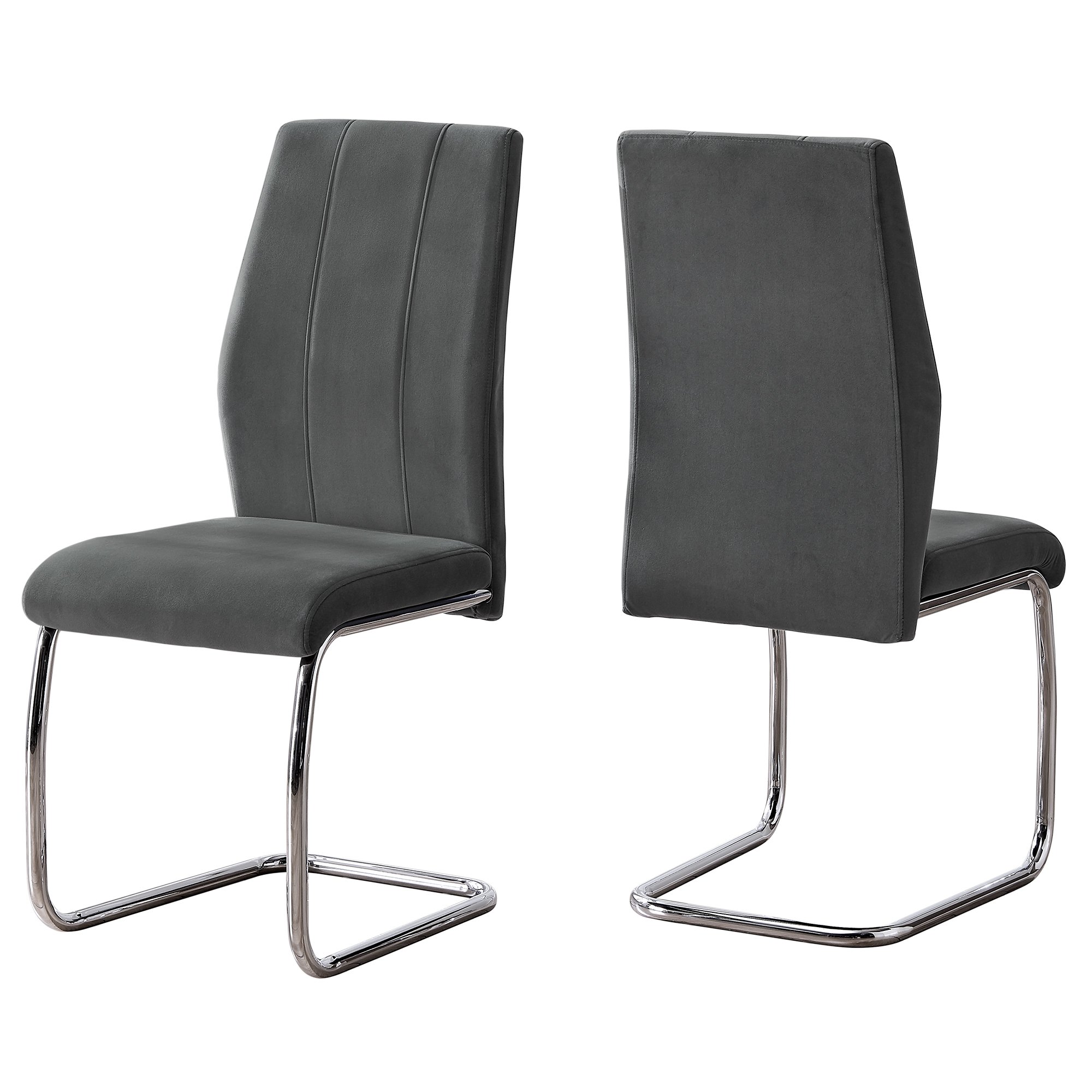 Two elegant velvet dining chairs with chrome metal legs, showcasing a modern design and comfortable foam cushioning.