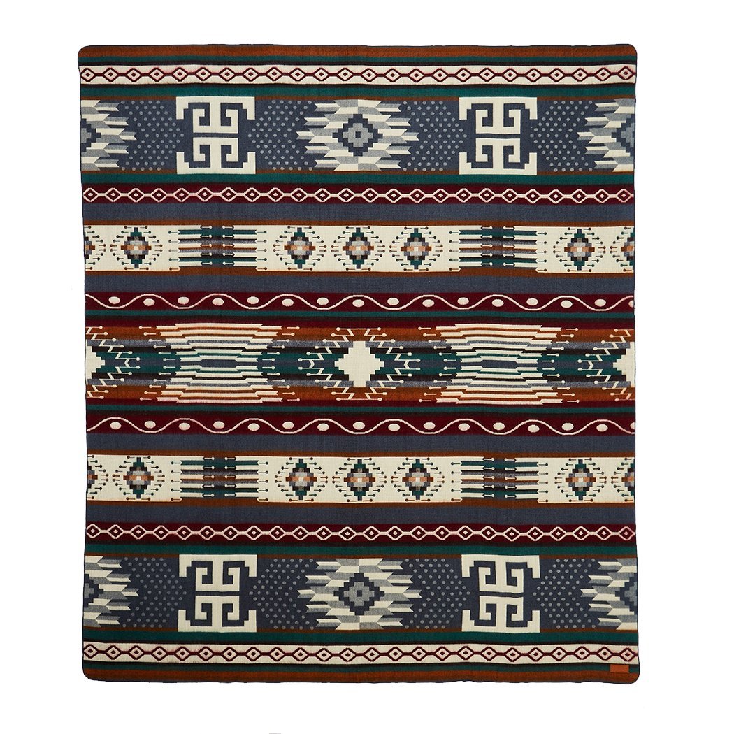 Ultra Soft Southwestern Dot Handmade Woven Blanket featuring deep blues, cream, and rusty red in a traditional Ecuadorian design.