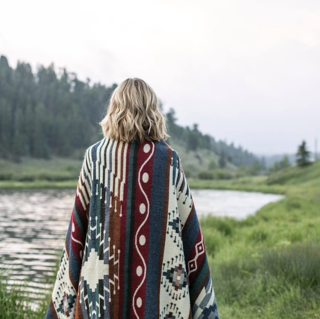 Ultra Soft Southwestern Dot Handmade Woven Blanket featuring deep blues, cream, and rusty red in a traditional Ecuadorian design.