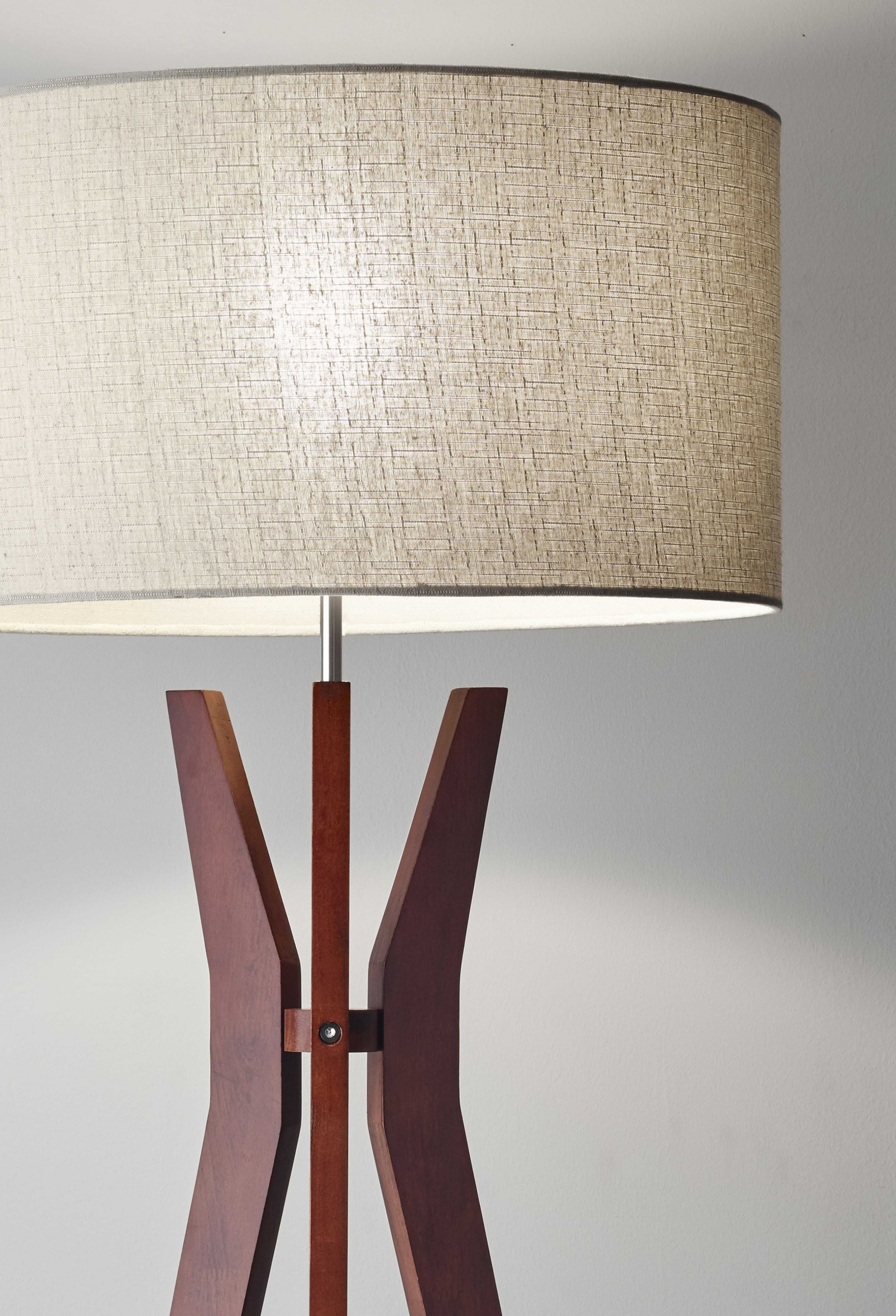 Walnut Wood Floor Lamp with Tripod Base and Oatmeal Linen Shade, featuring a round shelf for storage.