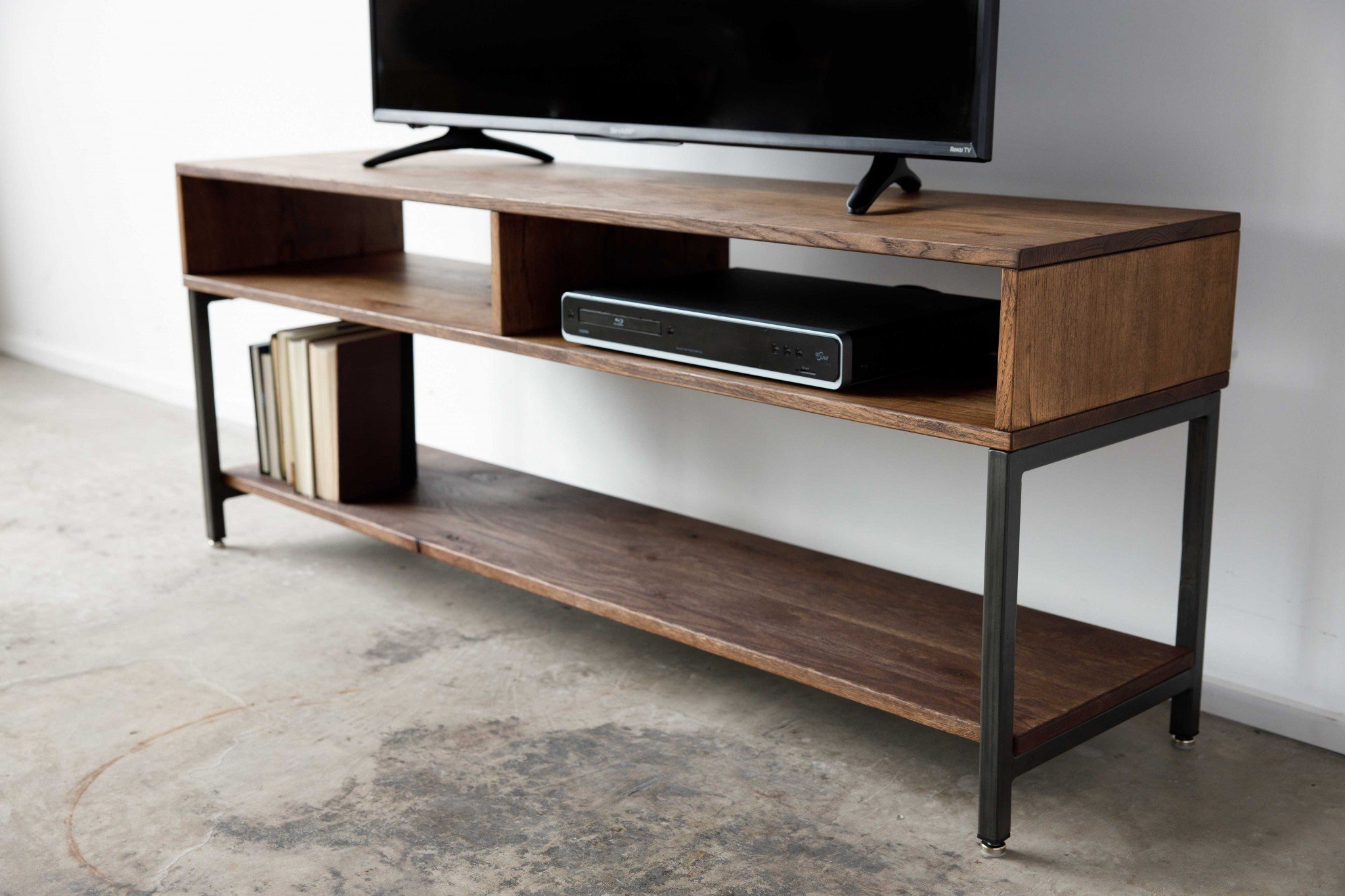 TV stand with books and electronics