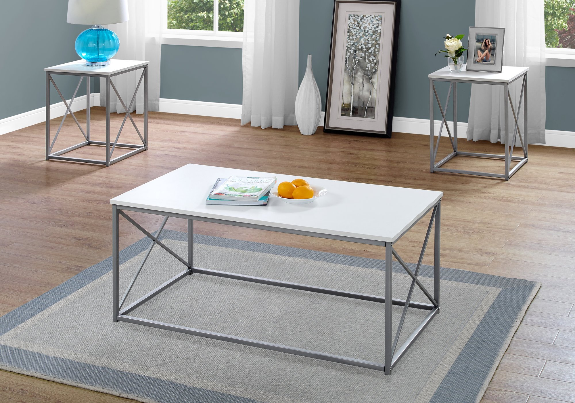 Elegant White Silver Metal Table Set featuring three stylish tables, perfect for home decor and displaying decorative items.