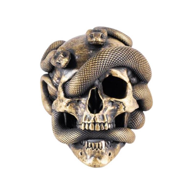 A detailed 3D resin sculpture of a skull entwined with two venomous snakes, featuring glowing eyes for a spooky effect.