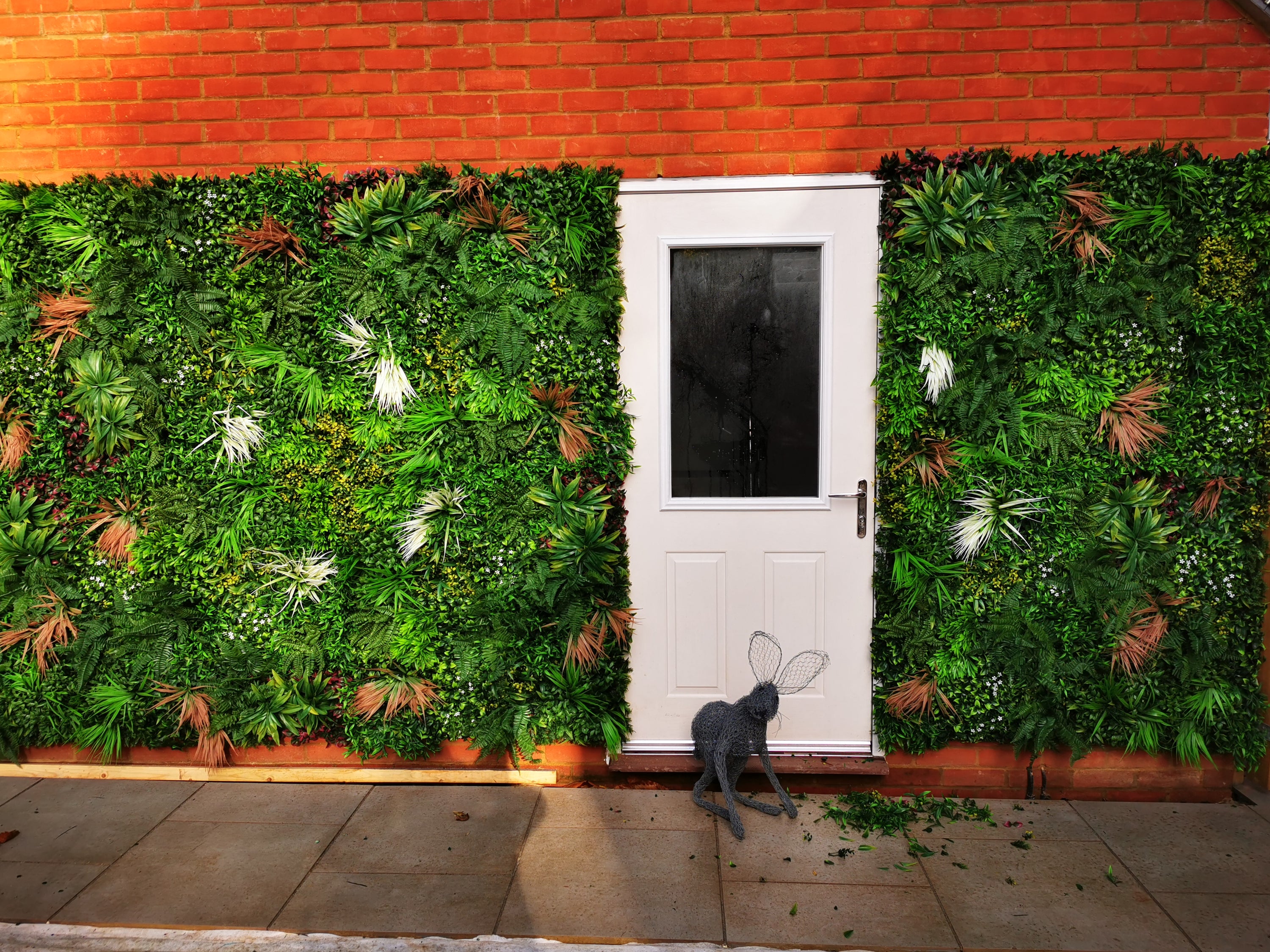 Artificial Deluxe Green Wall featuring lush tropical foliage, 100x100cm size, perfect for enhancing indoor and outdoor spaces.