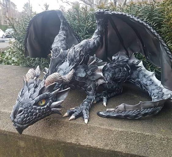 A beautifully crafted Big Squatting Dragon Sculpture made of resin, showcasing intricate scales and a lifelike design, perfect for outdoor decoration.