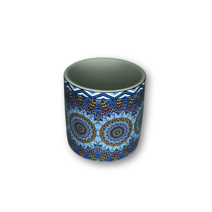 A vibrant blue bohemian patterned flower pot with a drain hole, perfect for small plants.