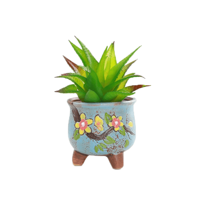 Blue pear-shaped ceramic succulent pot with floral design, sitting on three legs, perfect for indoor plants.