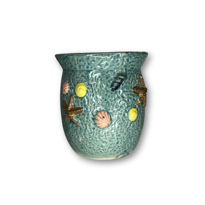 A decorative blue round pot featuring a flared edge and raised sea shell designs, perfect for indoor and outdoor plants.