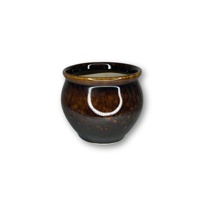 A stylish brown and black glazed pot with a drain hole, perfect for small plants.