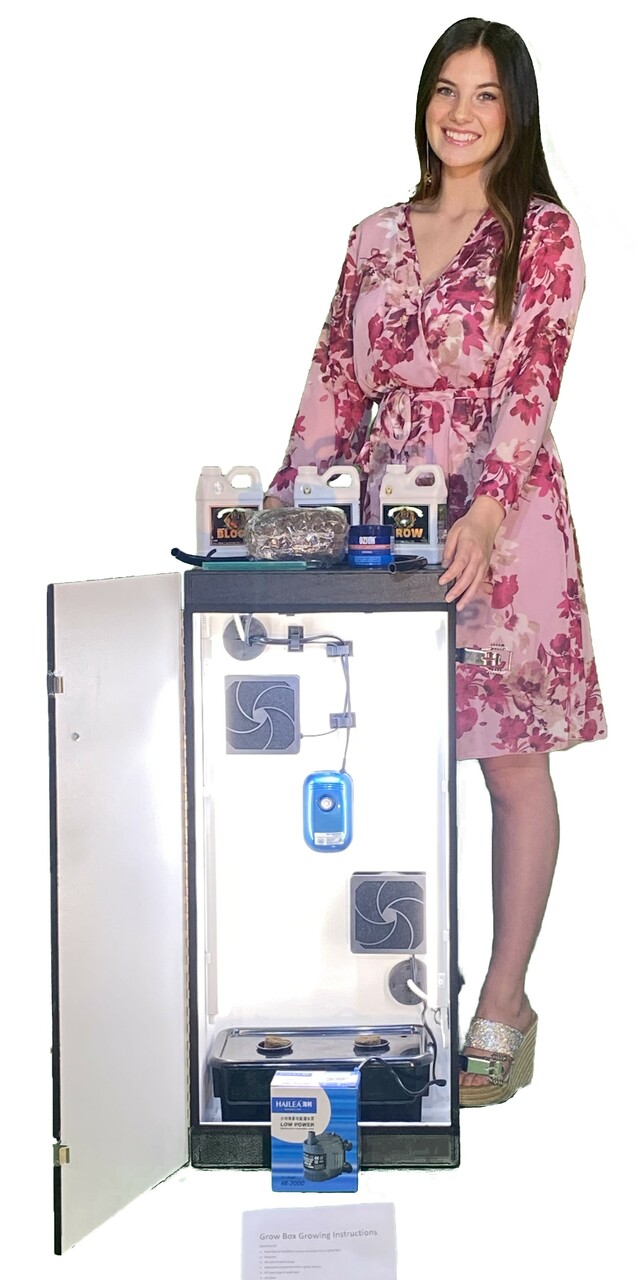 Woman with indoor grow box.