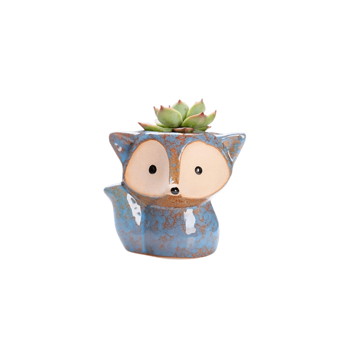 Dark blue ceramic fox succulent pot with drainage hole, perfect for indoor plants.