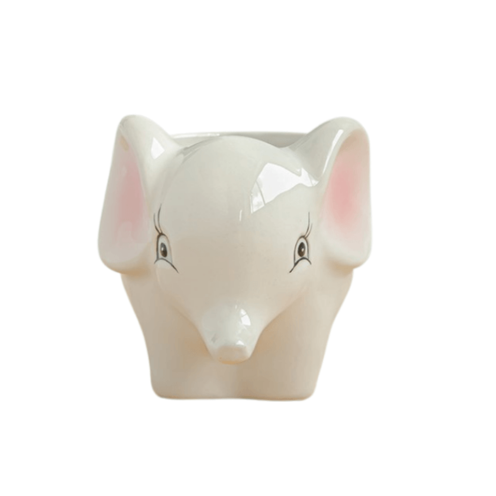 A cute porcelain elephant succulent pot with a smooth glazed finish, designed for indoor plants.