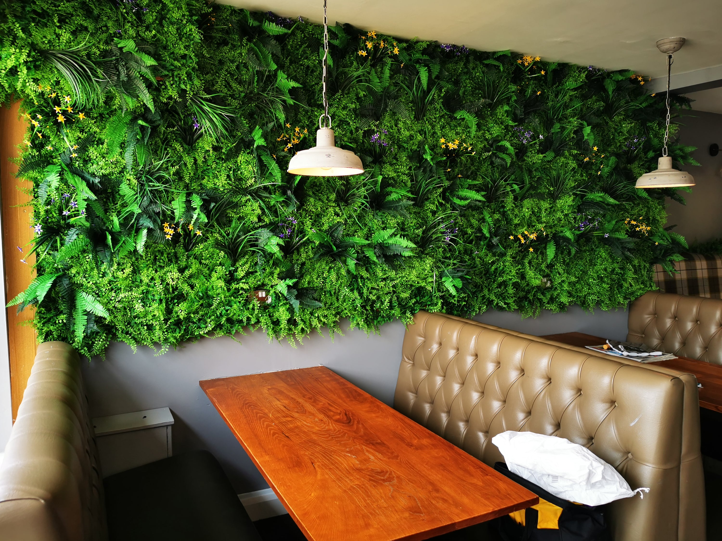 Flame Resistant Artificial Green Wall Hedge Panel measuring 100 x 100 cm, featuring a mix of lush leaves, grass, and fern for a dense, luxurious appearance.