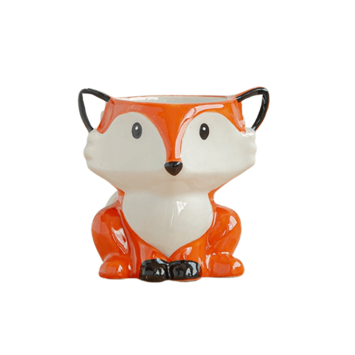 A charming porcelain glazed fox animal succulent pot with a smooth finish, perfect for indoor plants.