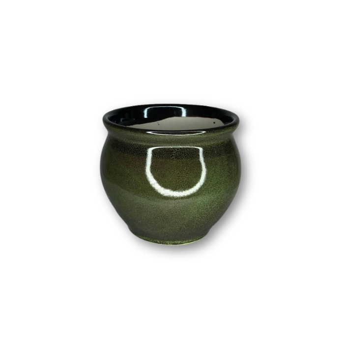 A vibrant green glazed ceramic pot with a drainage hole, perfect for small plants.