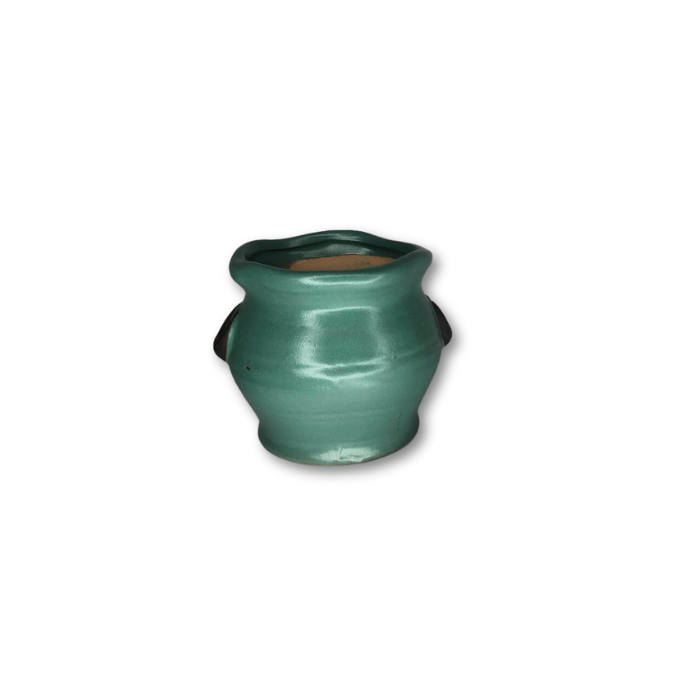 A vibrant green pot with handles, perfect for plants, featuring a drain hole at the bottom.