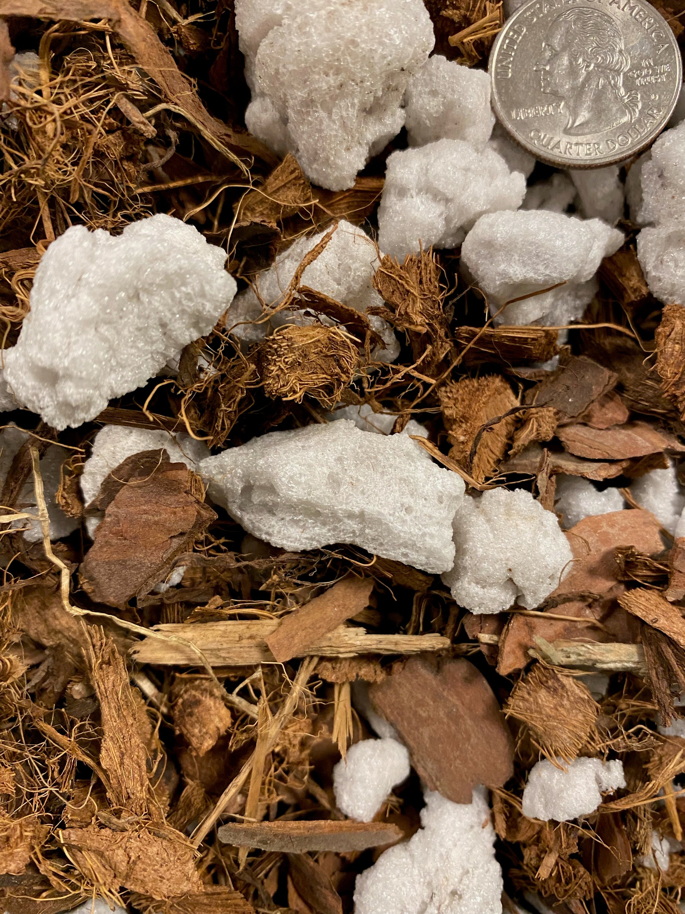 A bag of Orchid Chunky Mix soil featuring a blend of coconut husks, pine bark, and chunky perlite, designed for optimal orchid growth.