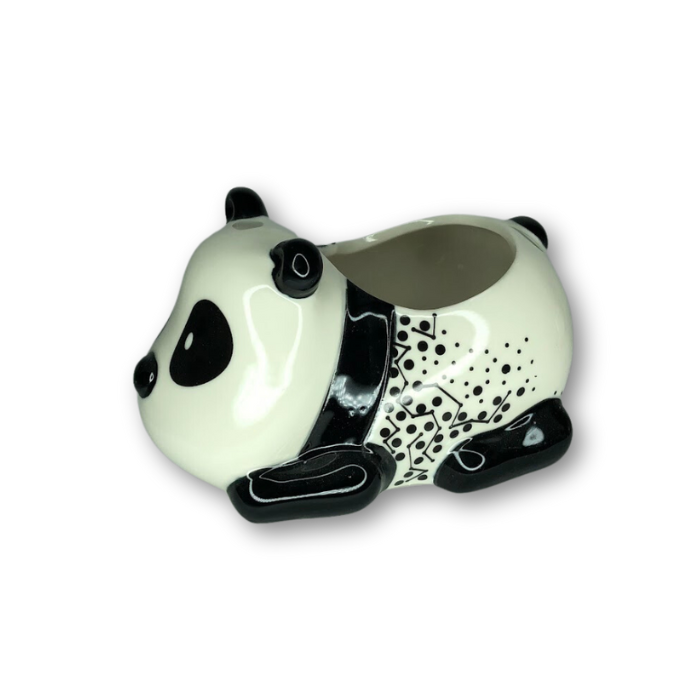 A cute panda figurine laying down with a unique spot pattern, perfect for home decor or as a planter.