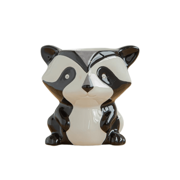 A charming racoon-shaped succulent pot made of glazed ceramic, featuring a drainage hole at the bottom, perfect for indoor plants.