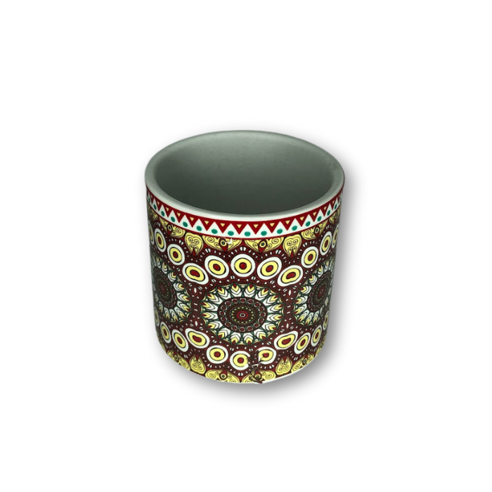 A vibrant red and brown bohemian patterned flower pot, perfect for small plants, featuring a drainage hole at the bottom.