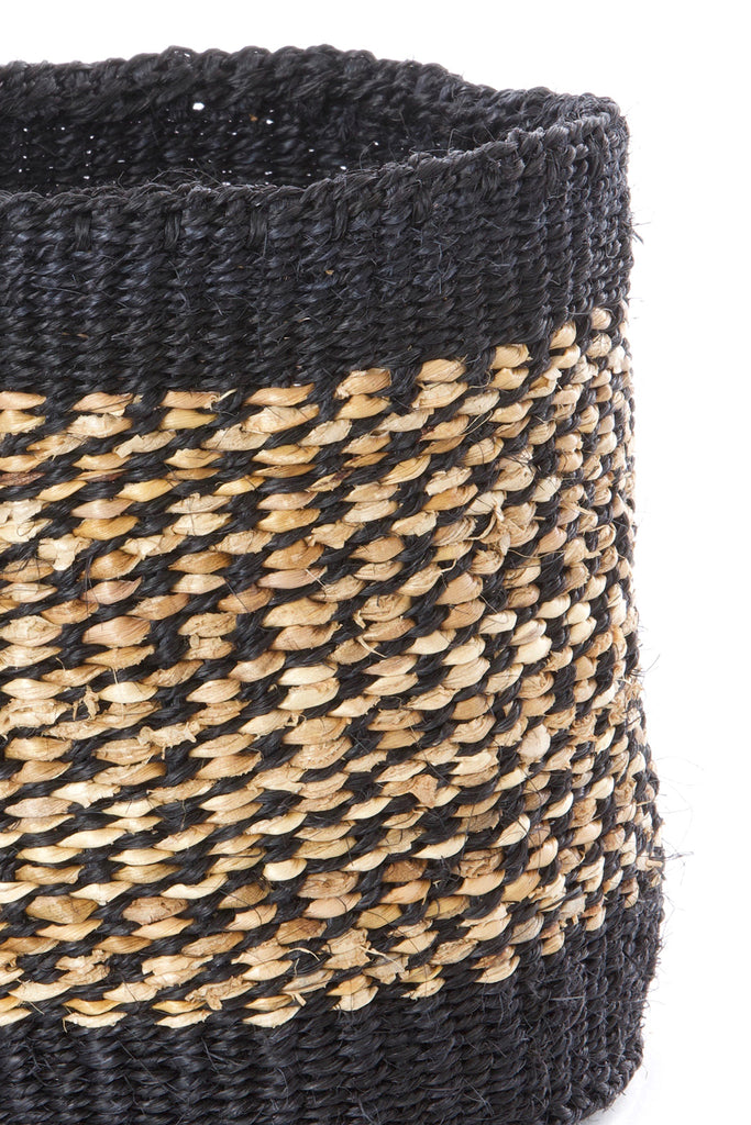 Set of three handwoven sisal and banana fiber baskets in varying sizes, showcasing natural colors and intricate patterns, perfect for storage and planters.