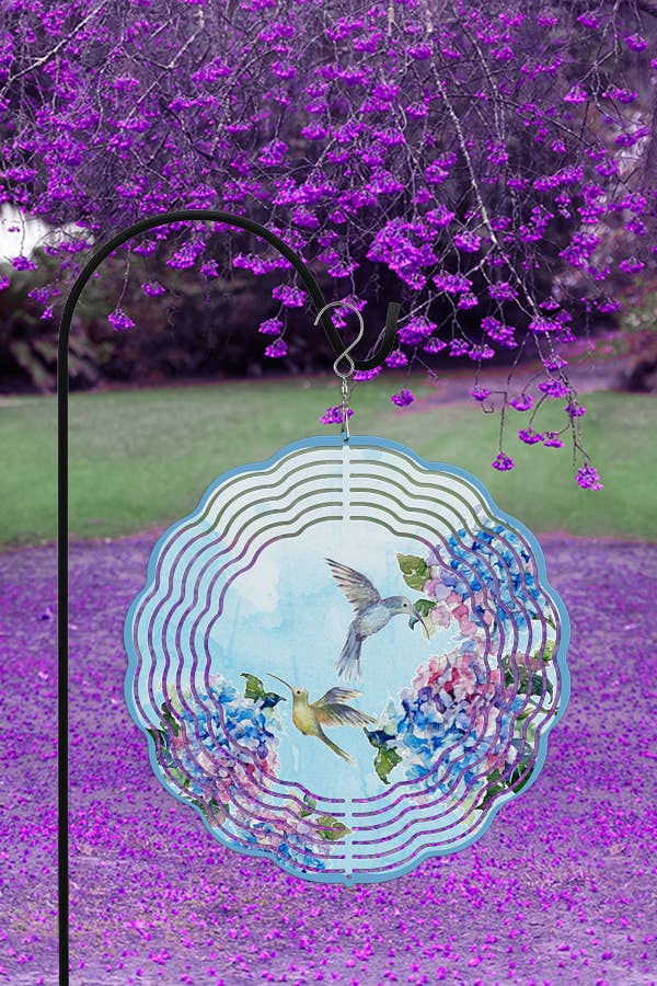 A vibrant 10-inch aluminum wind spinner featuring hydrangeas and hummingbirds, designed for outdoor decor.