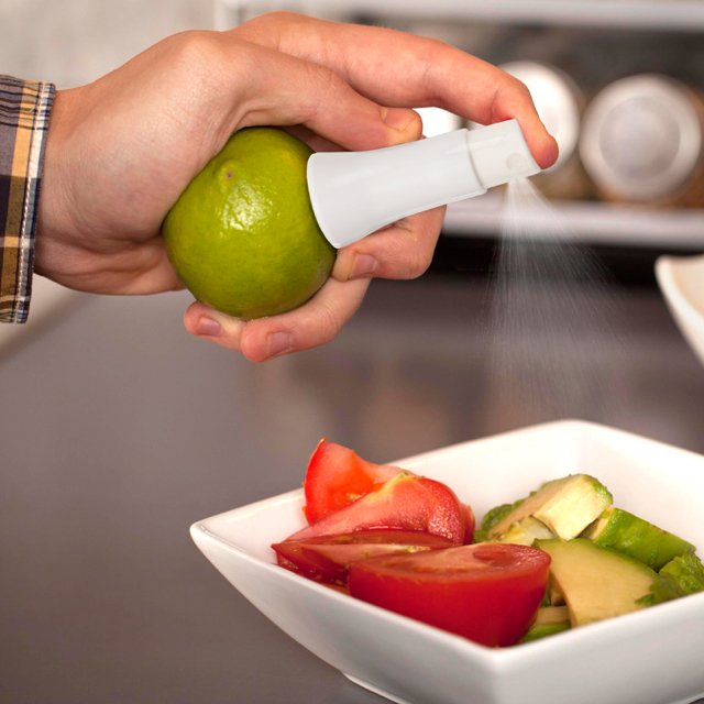 Spraying lime on a salad.