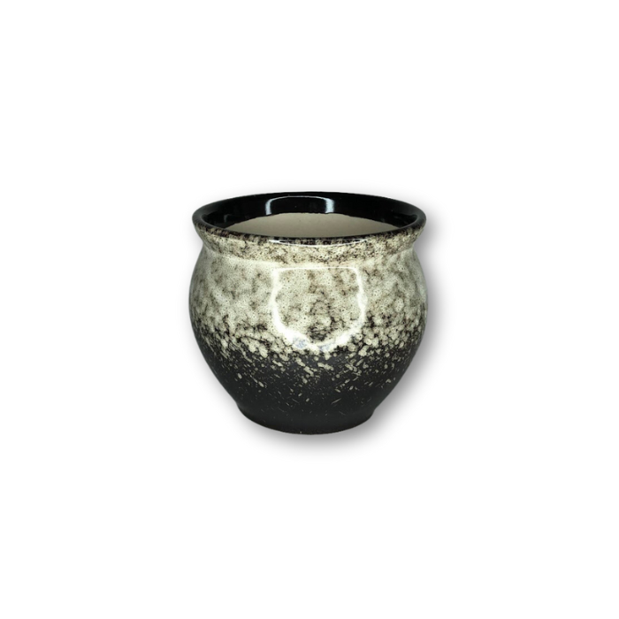 A stylish white and black glazed pot with a glossy finish, featuring a drainage hole at the bottom, ideal for small plants.