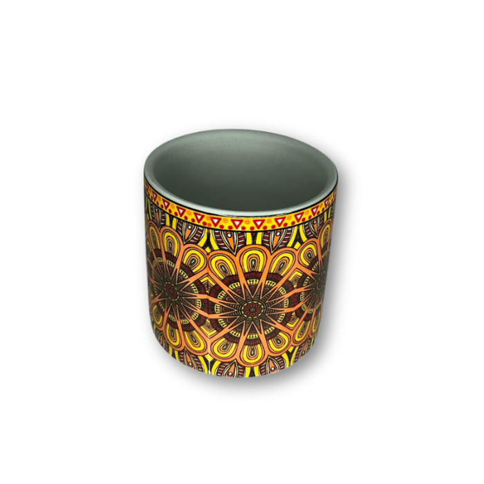 A vibrant yellow bohemian patterned flower pot with intricate designs, perfect for small plants and home decor.