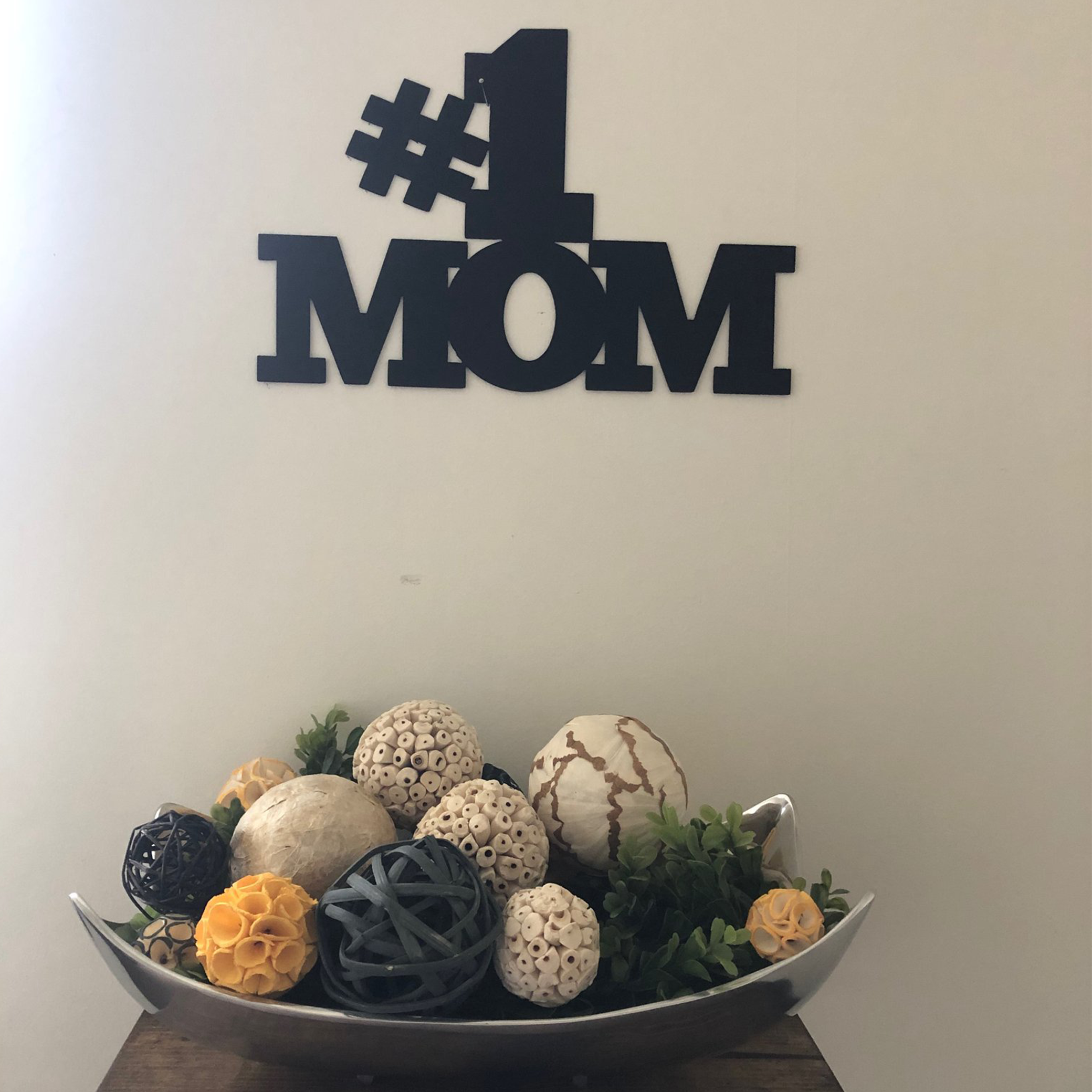 Elegant black metal wall art reading '#1 Mom', perfect for Mother's Day decor.