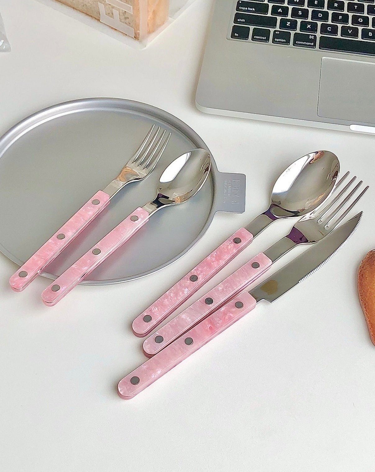 10-Pcs Sleek Modern Pinky Flatware Set featuring stainless steel utensils in a minimalist design, perfect for elegant dining.