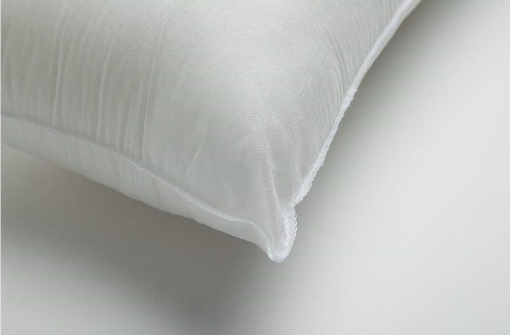 Hypoallergenic polyester pillow insert in 12x18 or 18x12 sizes, showcasing its soft texture and durable cotton blend fabric.