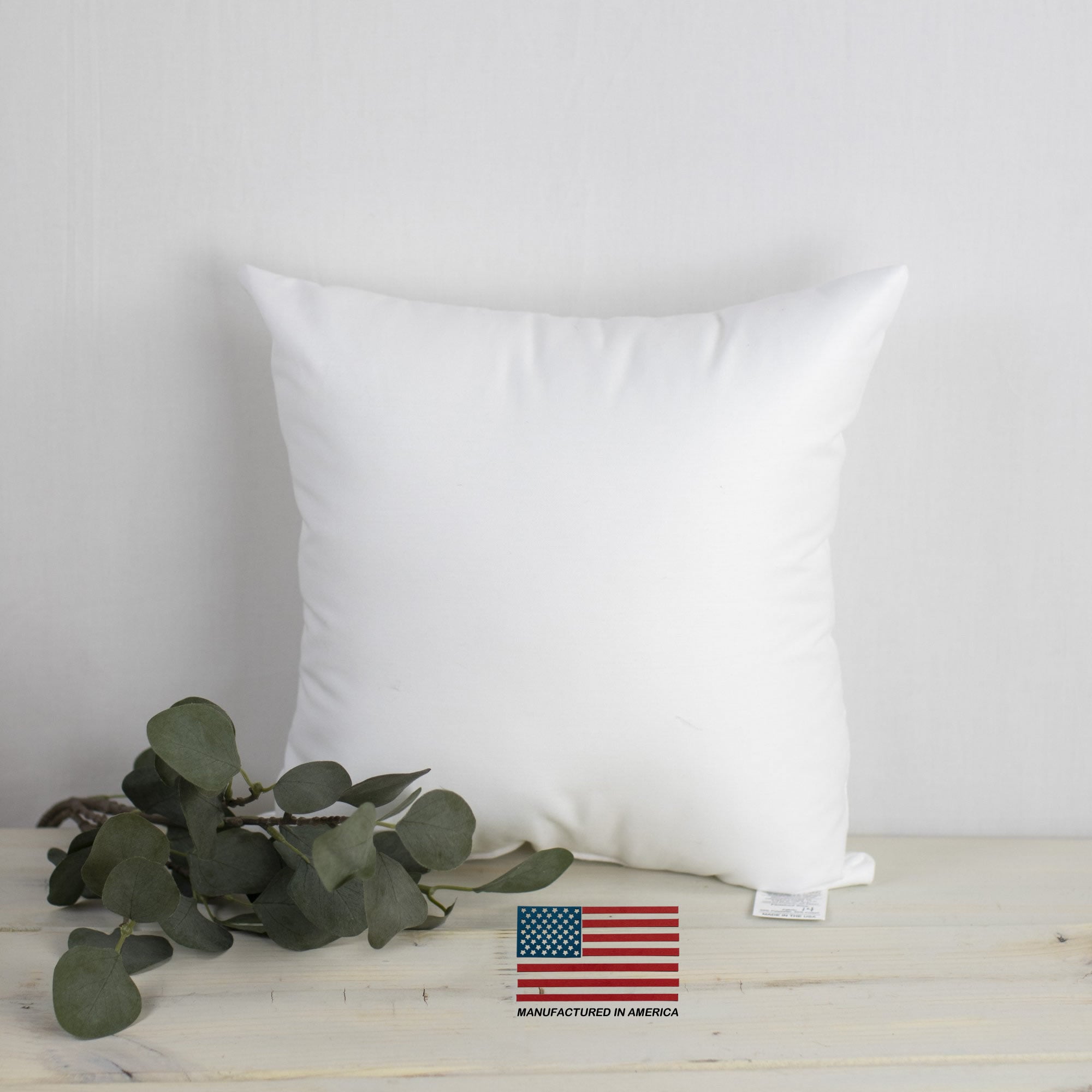 A 13x13 hypoallergenic polyester pillow insert, showcasing its plush texture and durable woven cotton blend fabric, perfect for indoor and outdoor use.