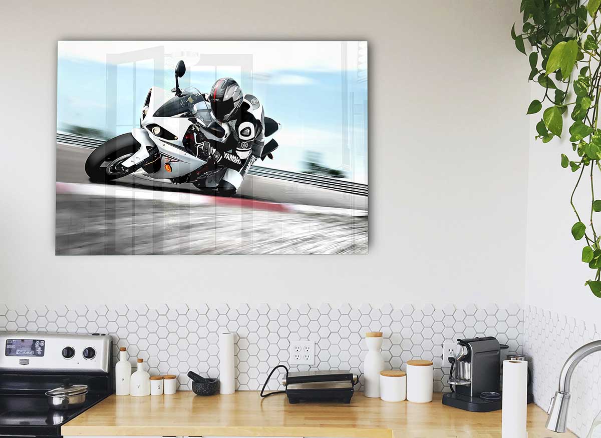 A modern glass print featuring the 2009 Yamaha Yzf R1 motorcycle, showcasing its sleek design and vibrant colors.