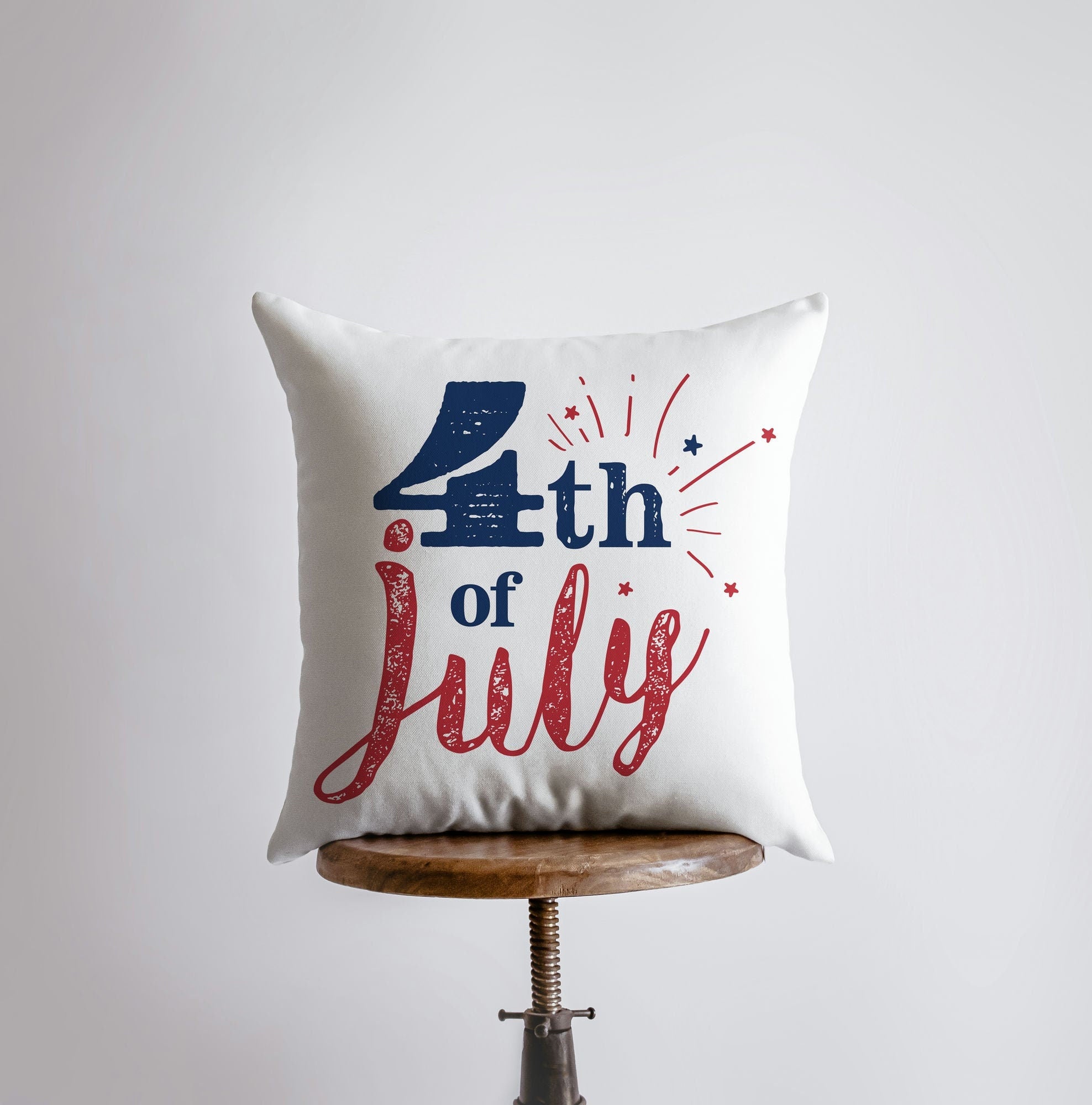 Handmade 4th of July pillow cover featuring vibrant fireworks and red star design, perfect for home decor.