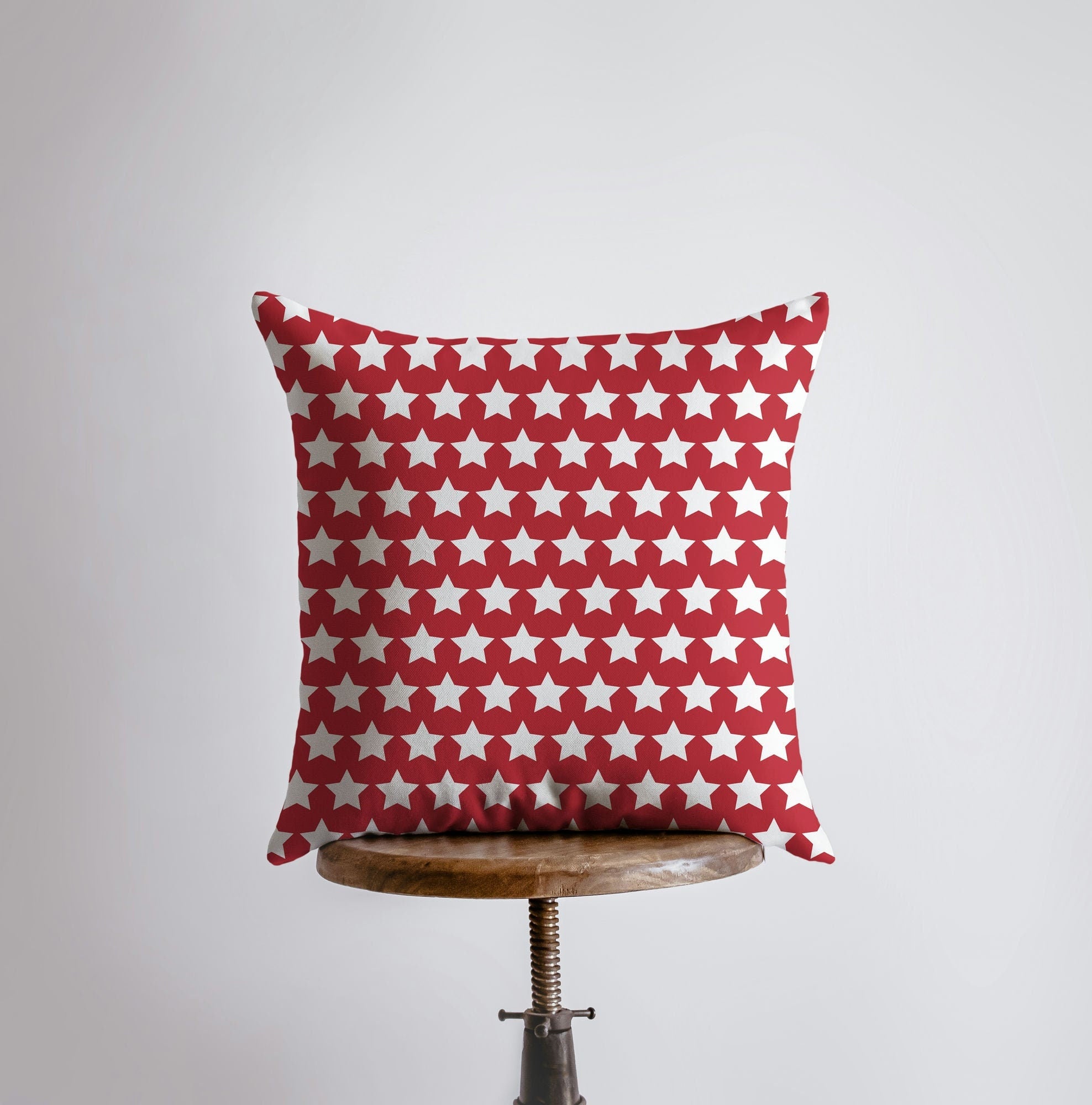 Handmade 4th of July pillow cover featuring vibrant fireworks and red star design, perfect for home decor.