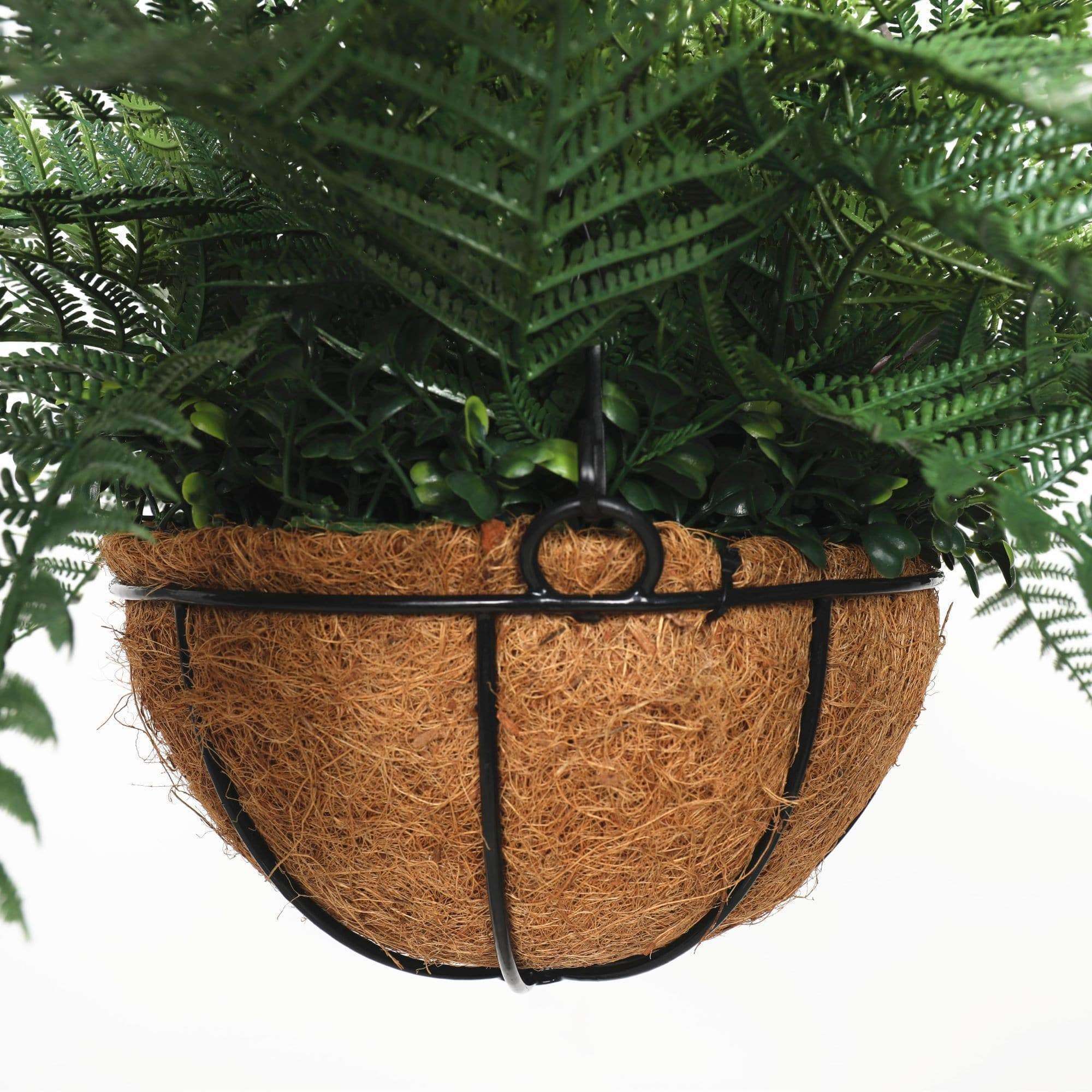 A 55cm UV Potted Fern Artificial Hanging Basket showcasing vibrant green fern leaves in a stylish hanging arrangement.