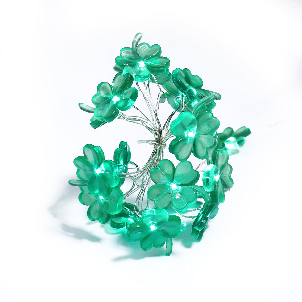 9.8FT string light featuring 30 handmade four-leaf clover LED lights, glowing green for festive decoration.