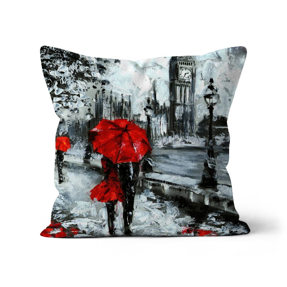 A decorative cushion featuring a couple against a backdrop of iconic London architecture, showcasing vibrant colors and intricate details.