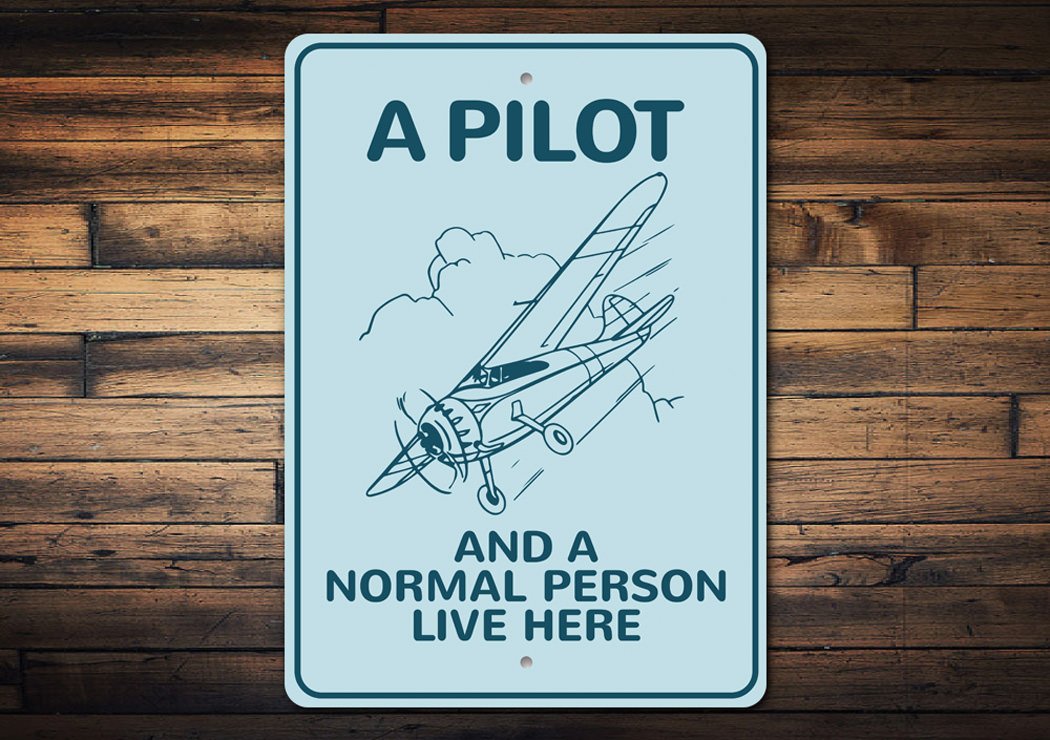 A Pilot Lives Here Aviation Sign made of durable aluminum, featuring aviation-themed design, perfect for home decor.