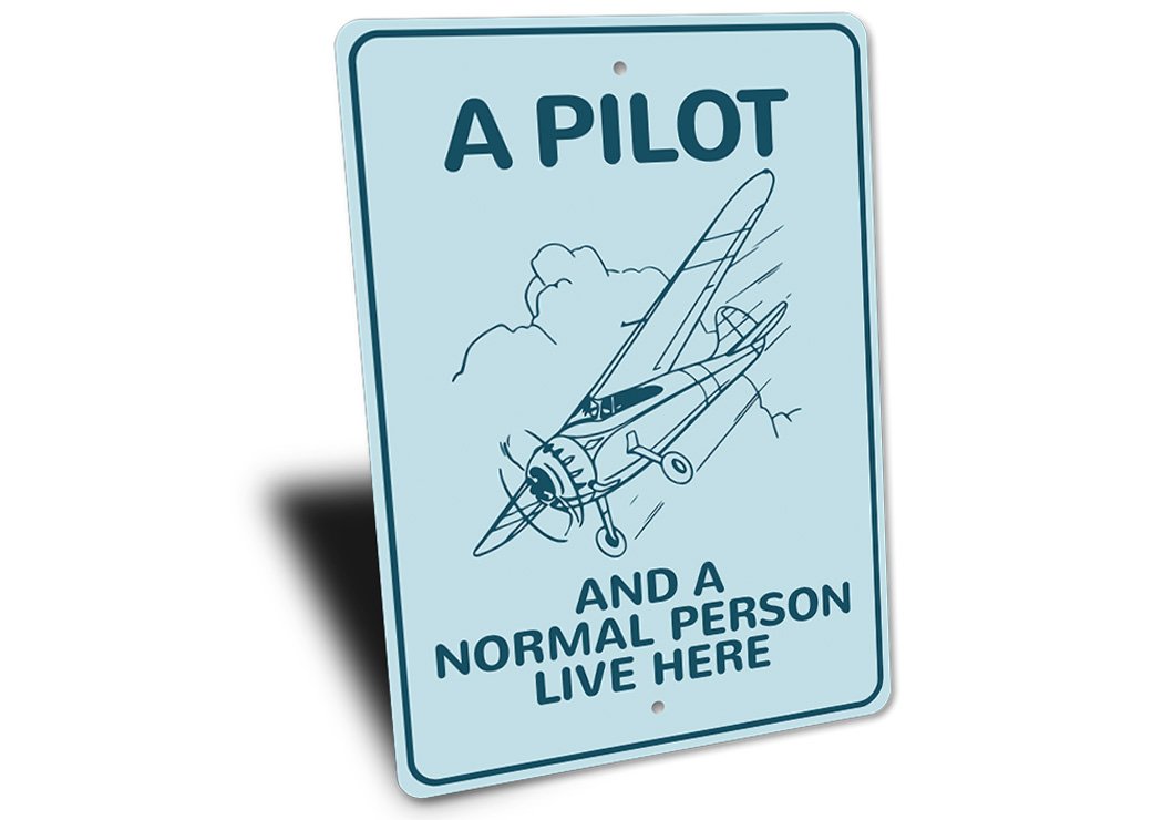 A Pilot Lives Here Aviation Sign made of durable aluminum, featuring aviation-themed design, perfect for home decor.