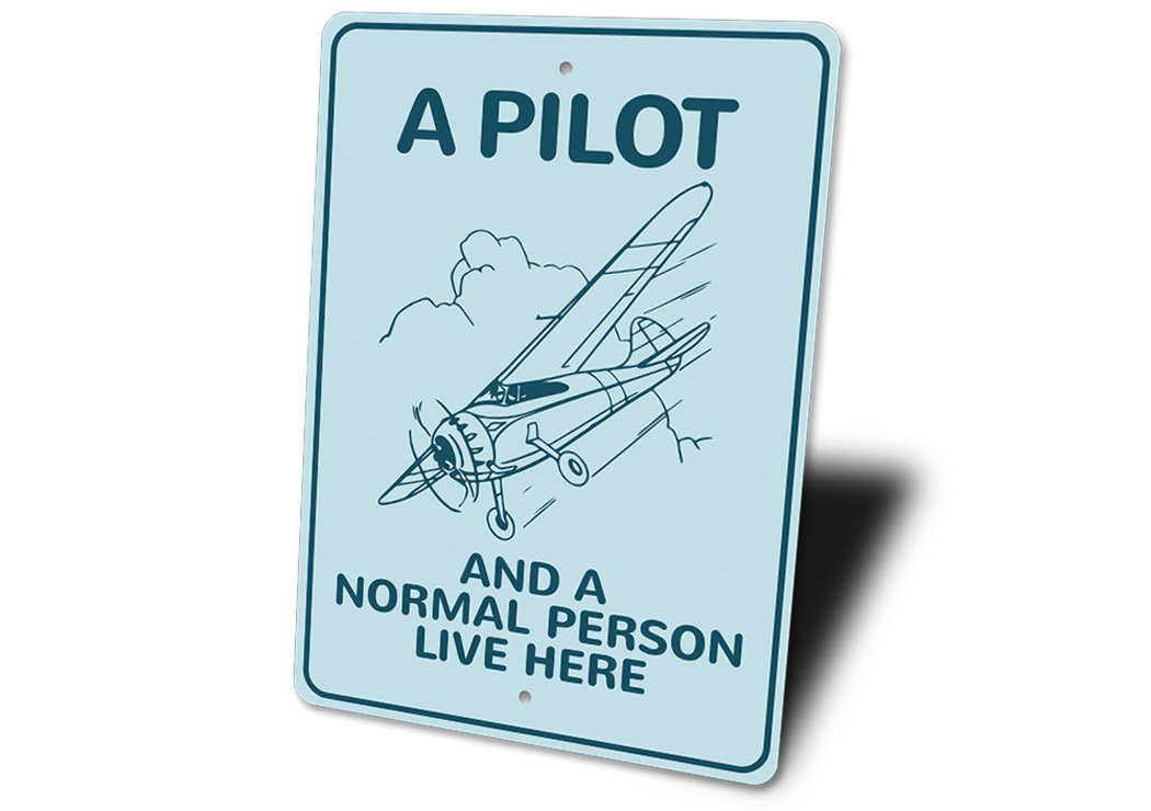 A Pilot Lives Here Aviation Sign made of durable aluminum, featuring aviation-themed design, perfect for home decor.