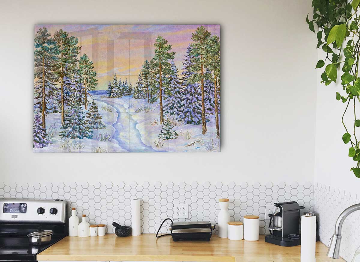 A stunning glass print featuring a serene snow-filled forest landscape, showcasing modern art style.