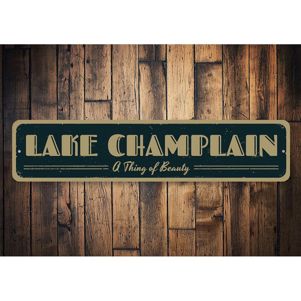 A decorative aluminum lake sign featuring the phrase 'A Thing of Beauty', showcasing a serene lakeside theme, perfect for home decor.