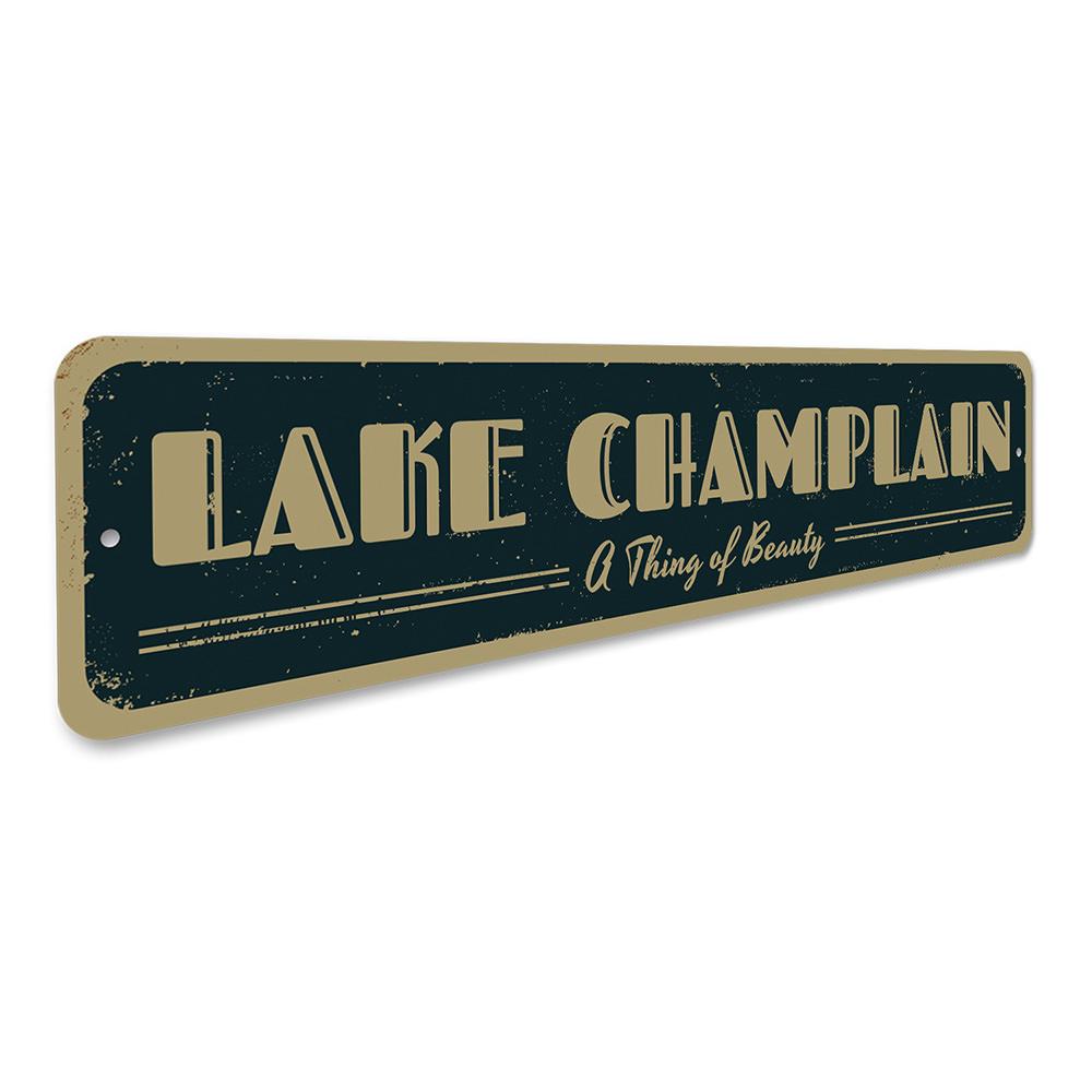 A decorative aluminum lake sign featuring the phrase 'A Thing of Beauty', showcasing a serene lakeside theme, perfect for home decor.