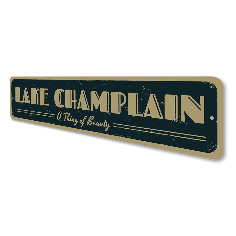 A decorative aluminum lake sign featuring the phrase 'A Thing of Beauty', showcasing a serene lakeside theme, perfect for home decor.